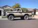 1979 Ford Bronco - Side view of a two-tone Ford Bronco parked on a street.
