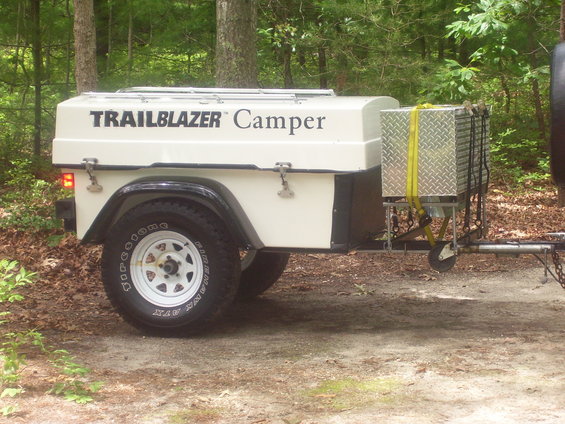 White Trailblazer Camper trailer side view with diamond plate storage box
