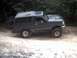 1996 Ford Bronco - This 1996 Ford Bronco is shown off-road, with a spare tire mounted on the rear.