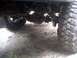 1996 Ford Bronco - The underside of a vehicle is captured, showing a large tire and suspension details.