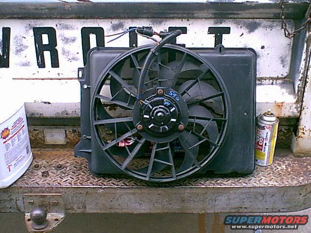 newfan.jpg Here is a 3.8 tarus 2 speed fan. $19 at the local junk yard. these have a high and low speed and really put out the air.