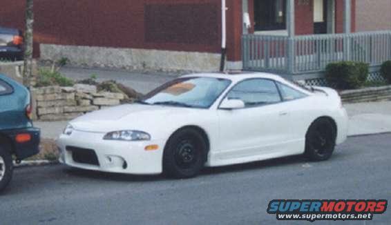 hulkcar.jpg it's kinda hard to tell, but he's got stock rims on the front, and aftermarket on the rear.  also, he's got a hulkamania rules sticker on his window...lol, damn ricer.