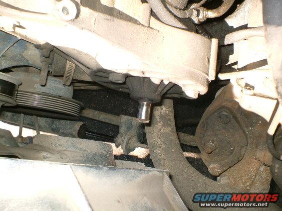 Engine pulley and water pump assembly, close-up view of mechanical parts