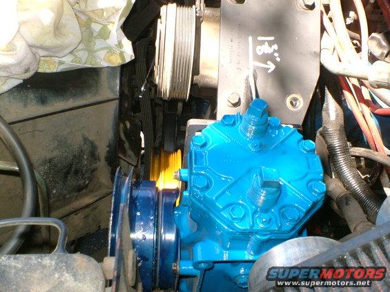 blue engine compressor with belts and pulleys