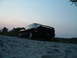1995 Ford Probe - A black 1995 Ford Probe coupe is parked on a gravel road under a dusky sky.