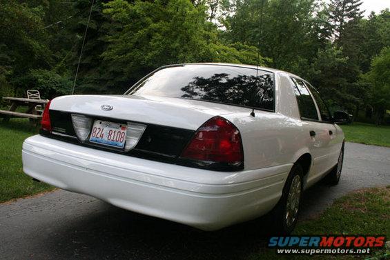 White 2003 Ford Crown Victoria rear view parked on driveway
