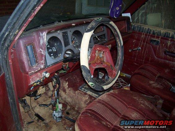 1986 Ford Bronco II interior, dirty red seats and dashboard
