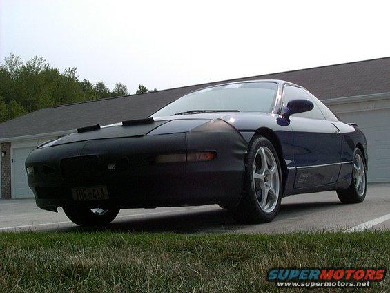 Blue 1995 Ford Probe GT with car bra