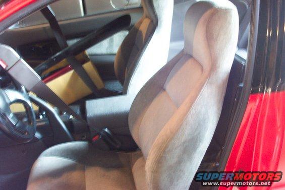 Interior of red car with racing seats and roll cage