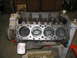 1979 Ford F-150 - Engine block with pistons visible, an oil filter attached, and signs of use.