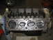 1979 Ford F-150 - Close-up view of an engine block, revealing the pistons within the cylinders.