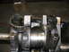 1979 Ford F-150 - Engine crankshaft bearings showing significant damage and wear, indicating a mechanical failure.
