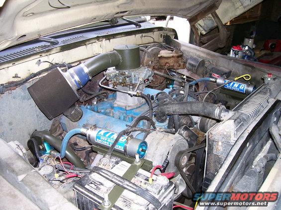 Engine bay with aftermarket air intake, carburetor, and a shock absorber labeled "KING OFF-ROAD RACING SHOCKS"