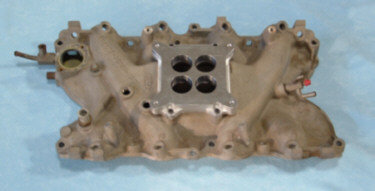 Intake manifold with four-barrel carburetor mounting
