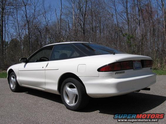 1997 Ford Probe parked on asphalt with trees in background