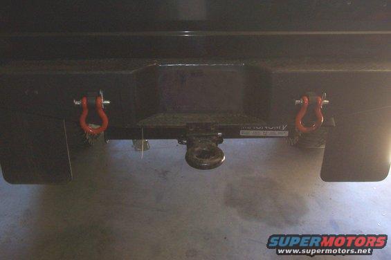 Rear bumper with tow hitch and red tow hooks