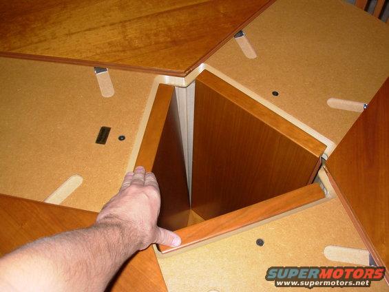 table05press.jpg The leaves are held down by a spring-loaded catch.  Press & they release, rising automatically.