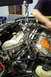 1995 Ford Taurus - Engine removal in progress with a chain hoist. Part number FA 950 is visible on the engine.