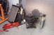 1995 Ford Taurus - Various engine components and tools are laid out on the garage floor.
