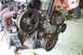 1995 Ford Taurus - Close-up view of an engine assembly, showing various components and belts.