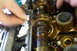 1995 Ford Taurus - Mechanic's hands work on an engine's internal components, likely during a refresh or swap.