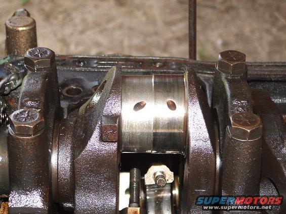 Close-up of engine crankshaft with connecting rod and bearing