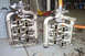 1995 Ford Taurus - Two intake manifolds are shown side-by-side on a garage floor.