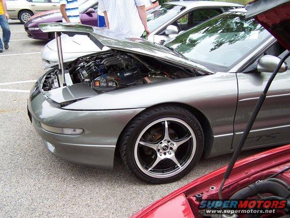 Silver 1995 Ford Probe with hood open, showing engine bay