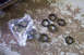 1995 Ford Taurus - Several engine seals are laid out on a concrete surface, some still in their plastic packaging.