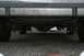 1989 Ford Crown Victoria LTD - Underside view of a vehicle's rear differential and exhaust pipes.