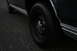 1989 Ford Crown Victoria LTD - Close-up of a dark sedan's wheel and side trim, with a Supermotors watermark visible.