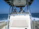 1979 Ford F-250 - Two people are on a boat, with the ocean in the background. The boat appears to be a Scout model.