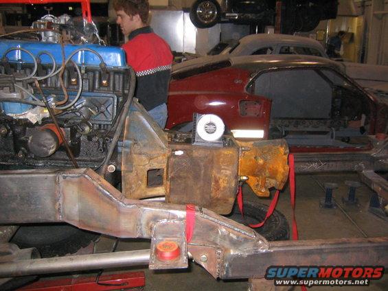 Engine and chassis assembly in a workshop