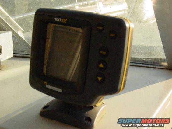 Humminbird 100 SX fish finder unit on a boat dashboard
