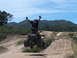 1999 Yamaha WARRIOR - Quad bike rider catches air on a dirt track.