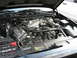 2003 Ford Crown Victoria - The engine bay of a 2003 Ford Crown Victoria shows its V8 engine and various components.