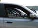 2003 Ford Crown Victoria - Multiple silver sedans, identified as 2003 Ford Crown Victorias, are lined up side-by-side.