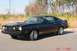 1977 Ford Mustang II - A black 1976 Ford Mustang II Cobra II coupe is shown from the front three-quarter view.