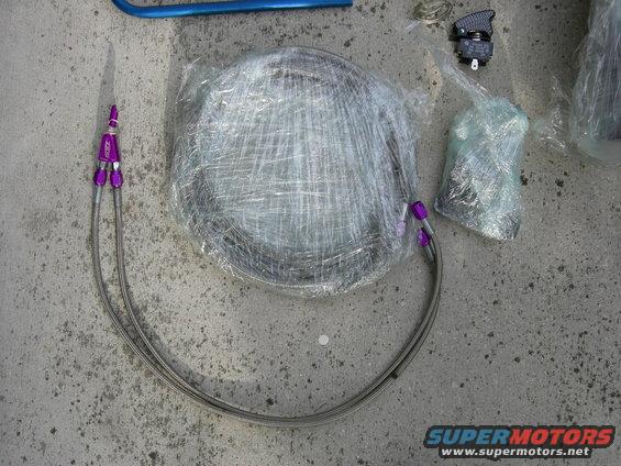 Wrapped round part with purple fittings and braided lines on concrete