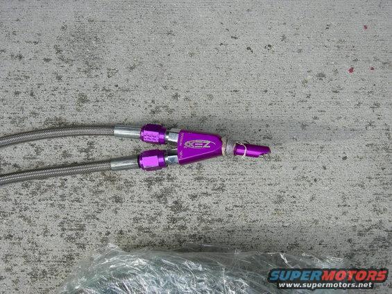 Purple anodized fuel line fittings with braided lines attached