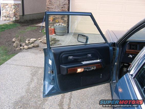 Blue interior door panel and dashboard of a sedan