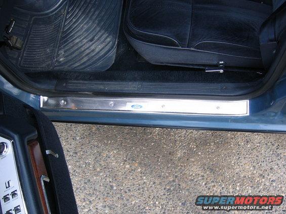 Ford logo on chrome door sill plate inside a vehicle