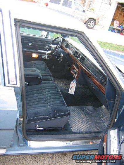 Interior view of a 1988 Ford Crown Victoria LTD, showing blue velour seats and dashboard