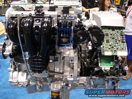 cutaway engine showing internal components and electronic control boards