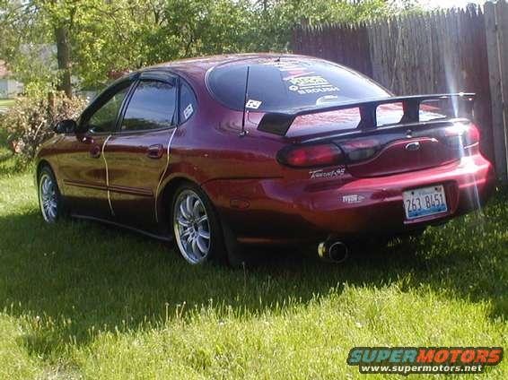 1998 Ford Taurus sedan, rear view, with spoiler and custom plate