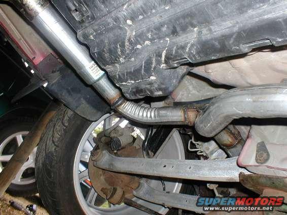 Undercarriage view of exhaust system and rear suspension components