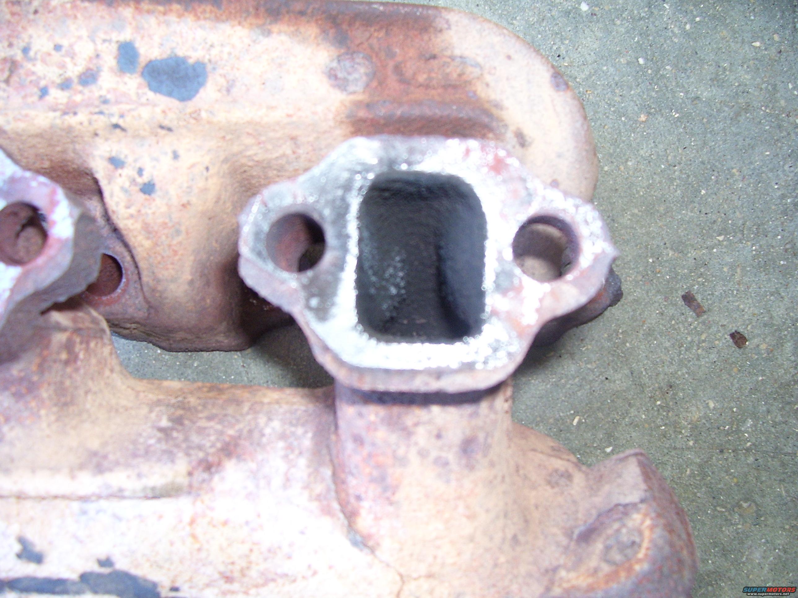 #8-cylinder.jpg #8 exhaust port, lots of junk from the PCV.