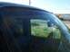 2003 Ford Ranger - Looking out from the driver's seat, the exterior landscape is reflected in the windshield.