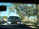 2003 Ford Ranger - A black Ford F-150 pickup truck is parked outside under trees, with another white truck visible to the left.