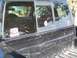 2003 Ford Ranger - Rear view of a pickup truck bed and window with stickers. Year is not discernible.